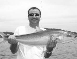 Steve Hoskins with an 86cm kingfish that ate a 30cm live squid.